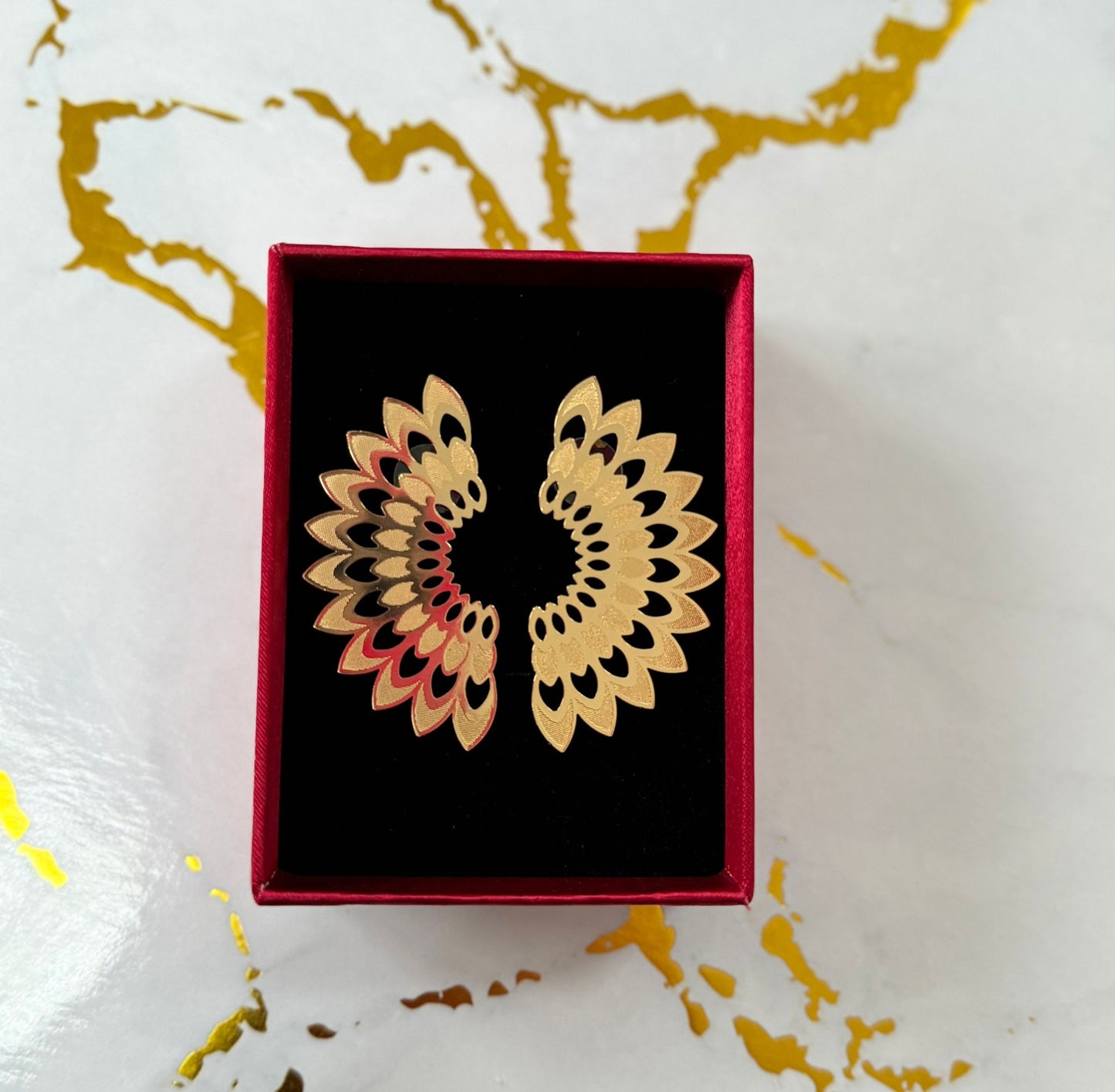 Pendientes pavo real